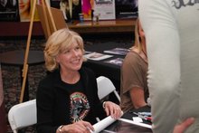 Adrienne King chats with a fan. Adrienne King chats with a fan.